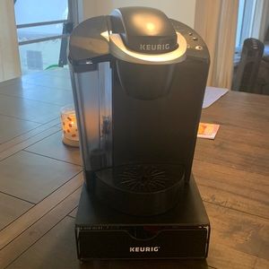 Black Keurig with black K cup holder also includes 4 purple reusable K cups